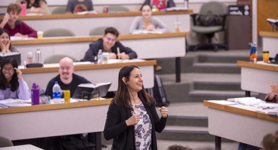 A teacher speaking to a room of students